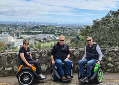 Three people using Omeos up a mountain in Auckland